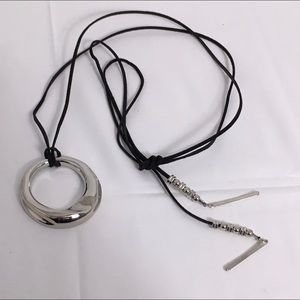 Free with purchase over $15 / silvertone pendant